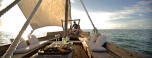 Romantic sunset dhow cruise Zanzibar honeymoon packages with golden ocean horizon