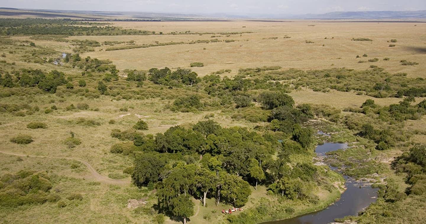 Maasai Mara National Reserve aerial view showing savanna grasslands and Mara River