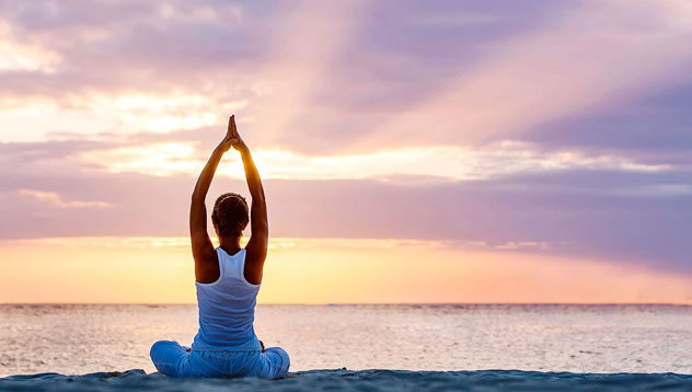 Sunset beach meditation Zanzibar — a deeply calming practice central to every Zanzibar wellness retreat