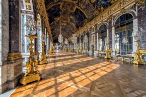 France Tours 2 Versailles Palace Hall of Mirrors with ornate gold decorations and crystal chandeliers, essential France tours destination